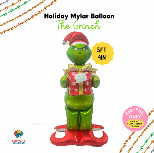 Holiday mylar balloon shaped like The Grinch with festive elements on a white background.